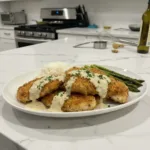 crispy parmesan chicken with a rich garlic sauce featured
